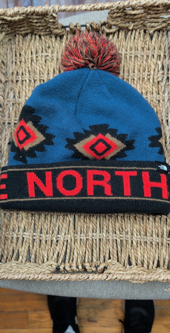 The North Face Blue Pom Beanie Hat with Red Accent